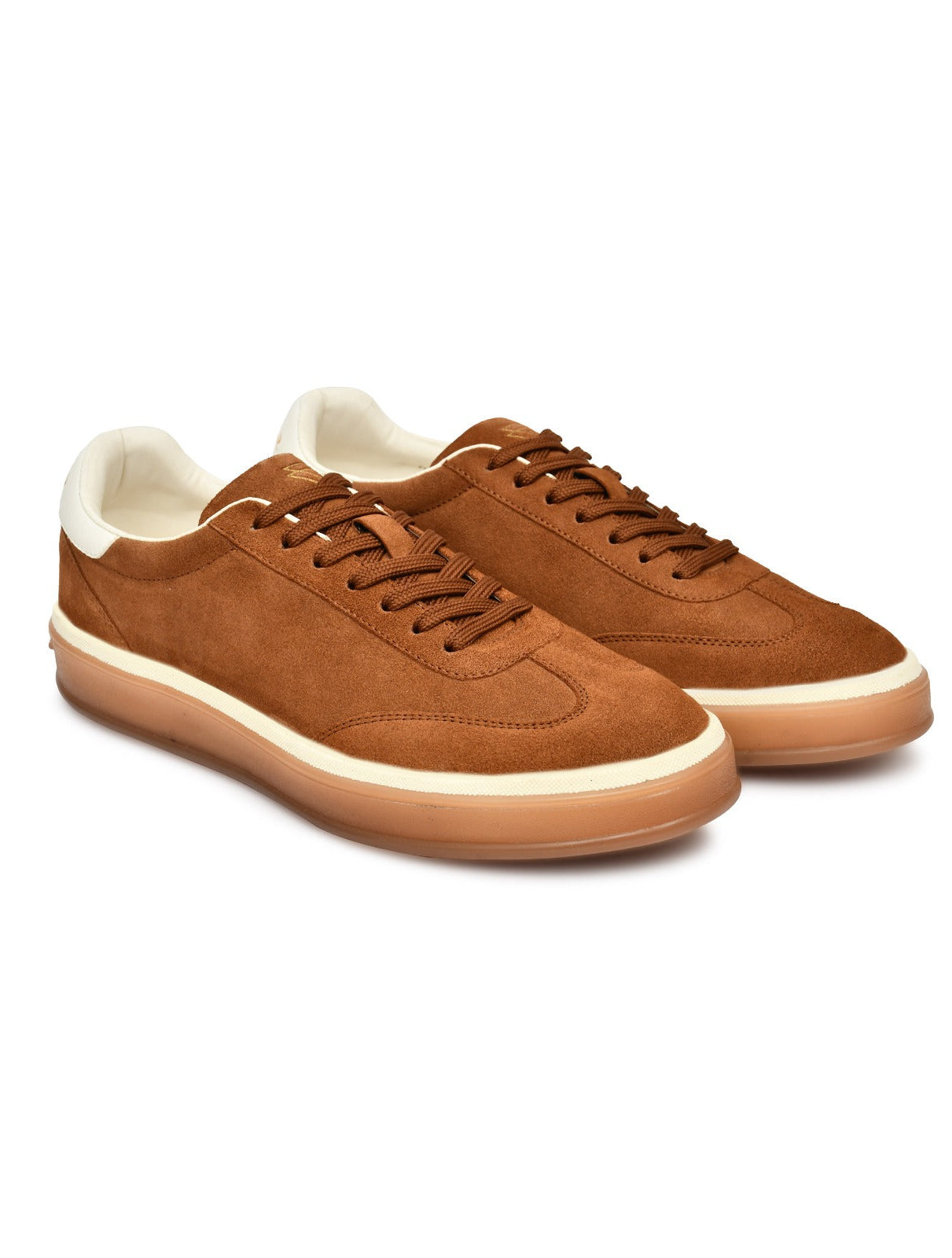 Brown suede sneakers with white soles on a white background