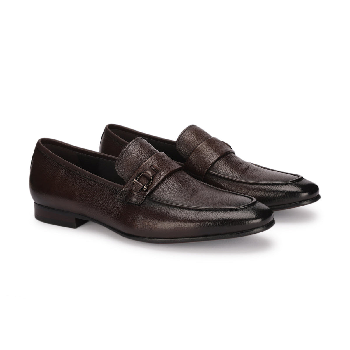 Pair of brown loafers on a white background