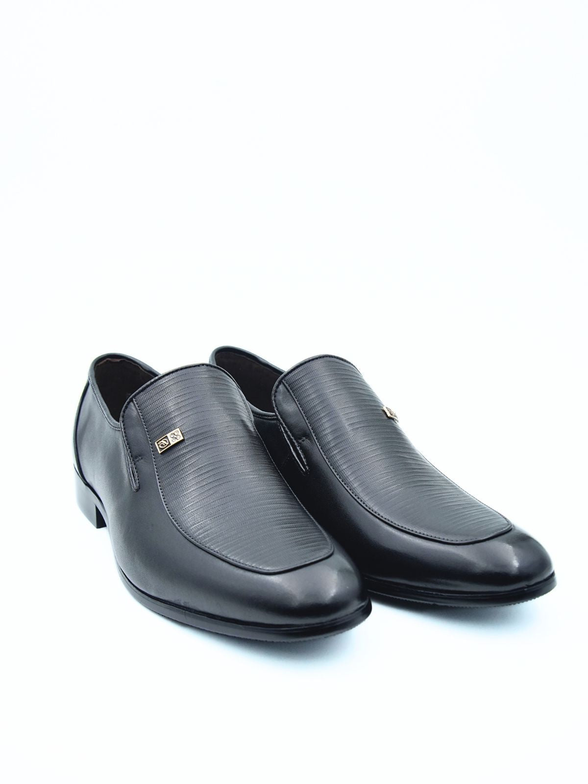 Pair of black leather shoes on a white background