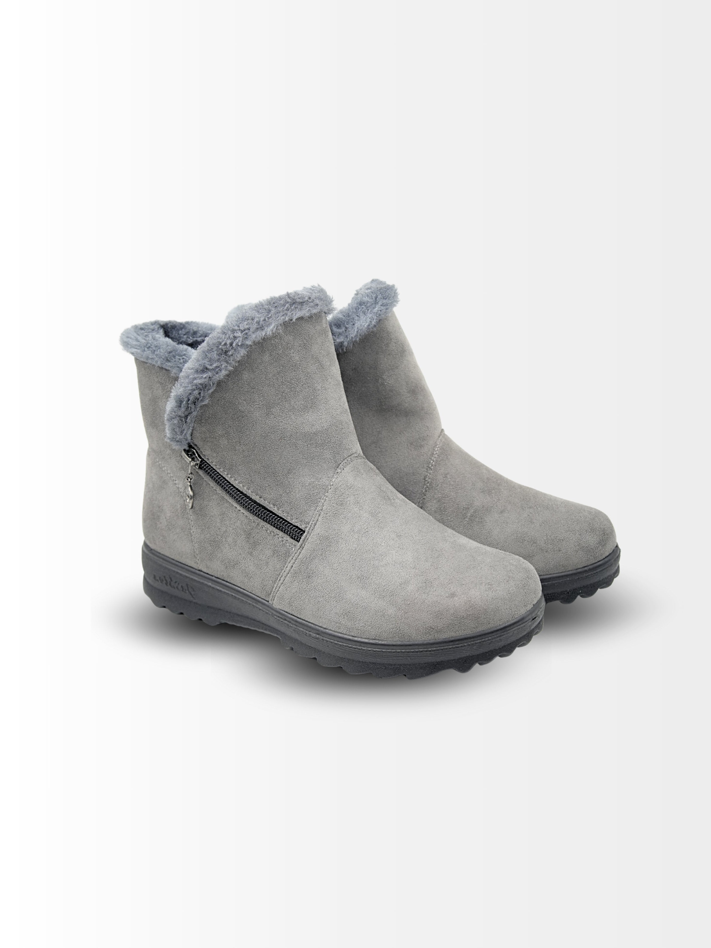 Gray suede ankle boots with fur trim on a white background