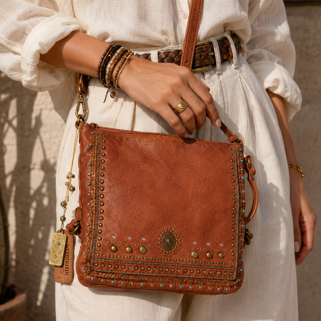 Savio: Cognac Embellished Hobo Bag In Veg Tan Leather