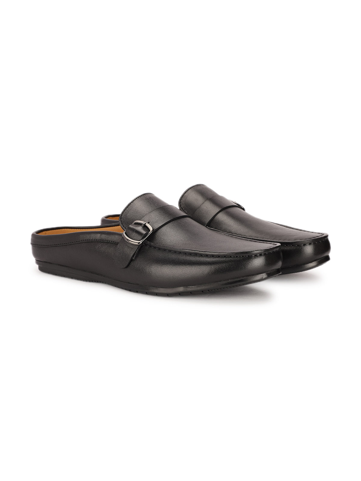 Pair of black loafers on a white background