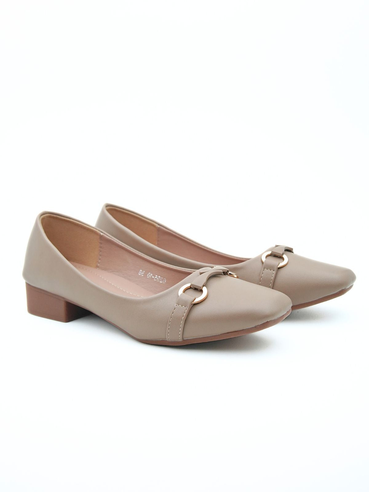 Pair of beige shoes with gold accents on a white background
