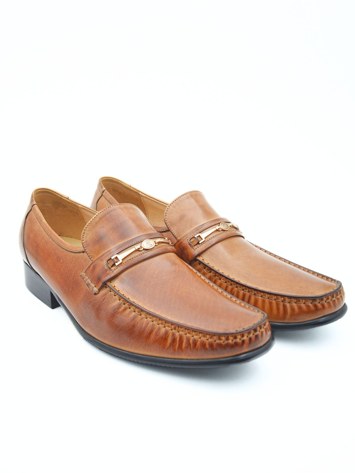 Pair of brown loafers on a white background