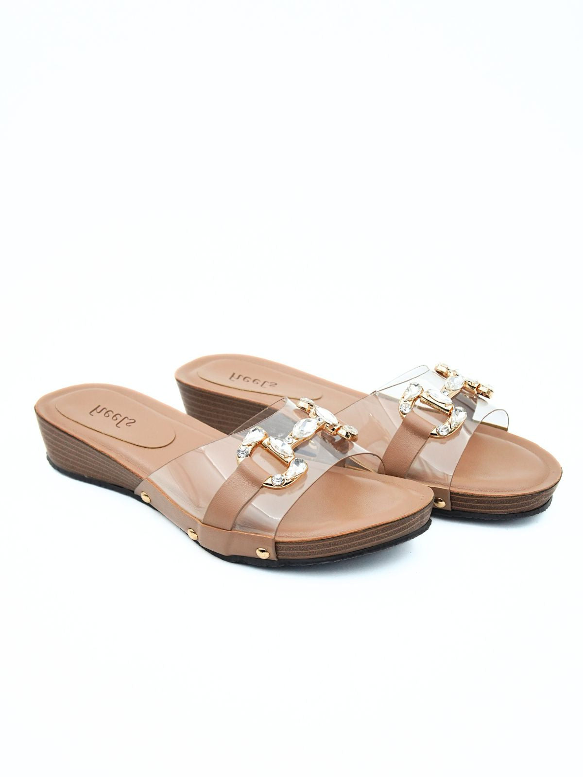 Pair of tan sandals with clear straps on a white background