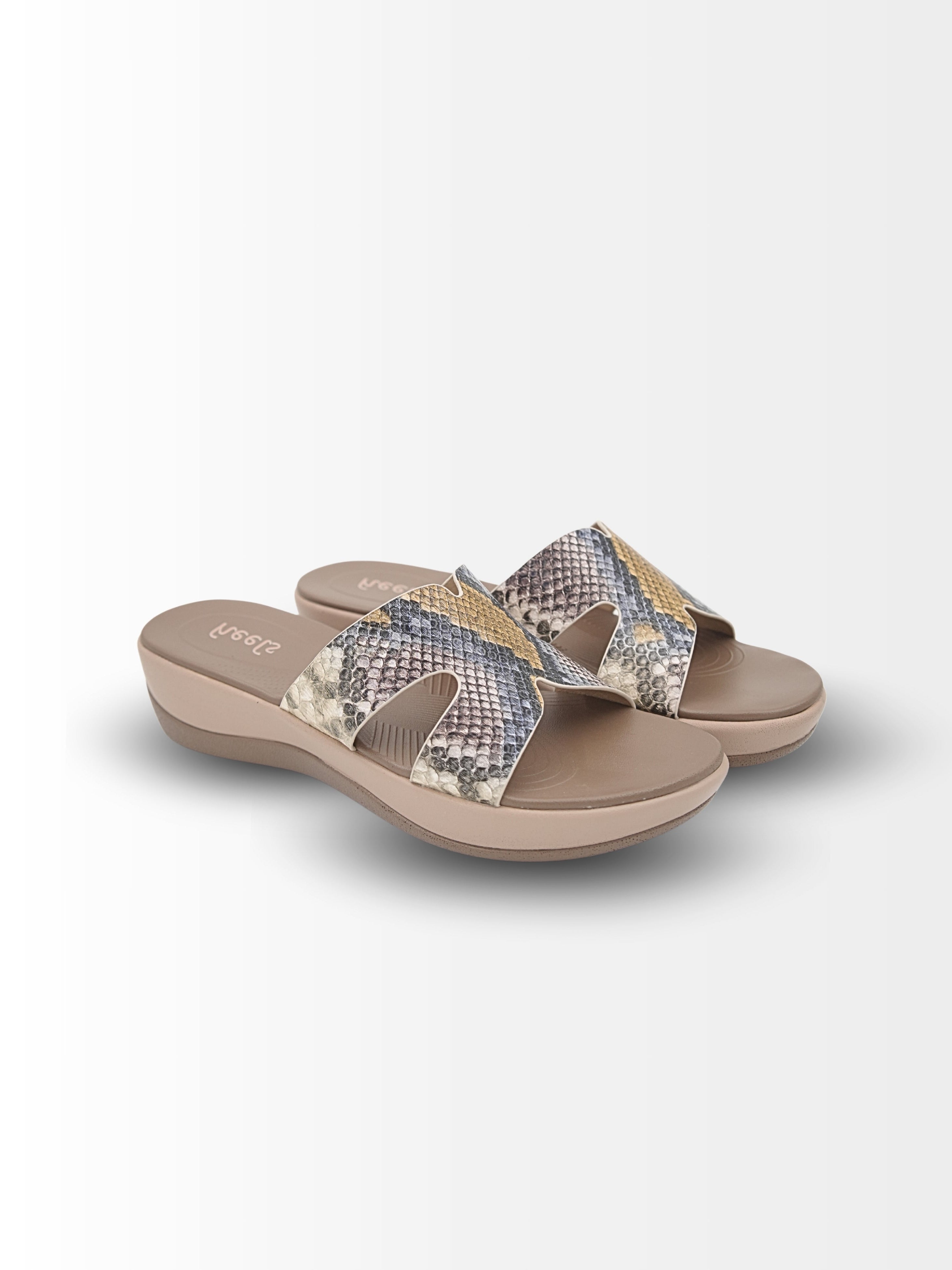Pair of sandals with snake print straps on a white background