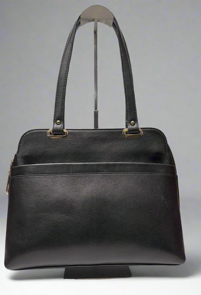 Black handbag with gold hardware on a white background